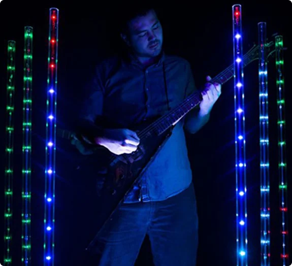 Guitarist surrounded by Freedom Stick lights